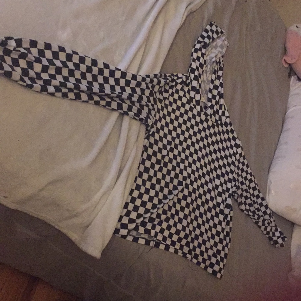 This is a cropped black and white checkered hoodie